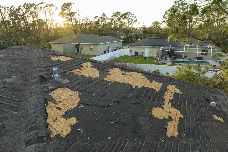  - Restore Roofing - Roofing Contractor in Hatfield, PA - Roof Inspection: Avoid Leaks & Save Money- roof inspections -  - damaged-house-roof-with-missing-shingles-after-hur-2023-11-27-05-09-59-utc